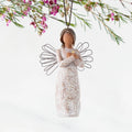 Front: Angel Ornament with wire wings, darker skin, arms crossed over gold heart, dress carved with symbols of remembrance