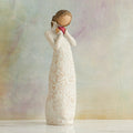 Willow Tree Je t'aime (I Love You), 8.5"h hand-painted standing resin figure holding red heart in cream dress with ruffled neck and carved with hearts, flowers and birds, in front of muted painting