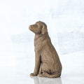 Brown wooden dog sitting figurine