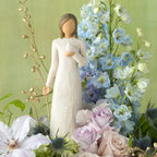 Willow Tree With sympathy, 9”h hand-painted standing resin figure in cream dress, holding white dove on hand, nestled in floral bouquet