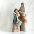 Nativity scene figurines - mother in blue holding child with father standing over them