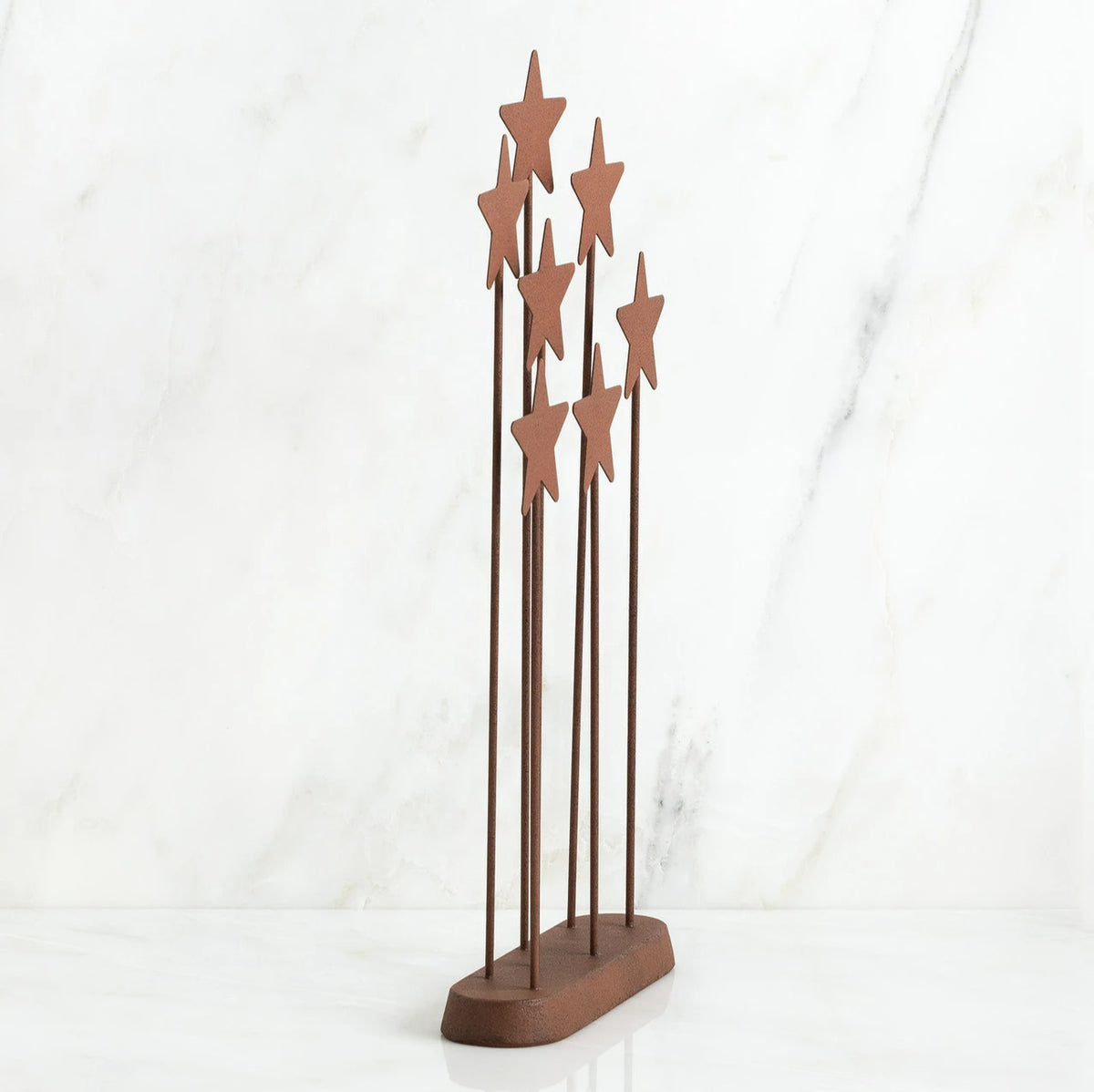 Bronze plaque with star stands on top of it
