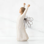 Side view of brunette girl figurine in white dress holding arms up with brown wire wings