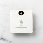 Back of white plaque reading piece title and sentiment, with Willow Tree logo