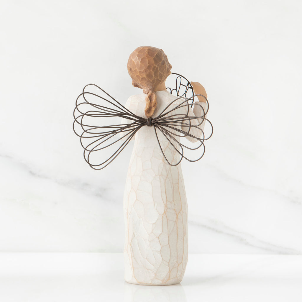 Back view of angel with tied back brown hair, holding up a circular wire sign that says "thank you"