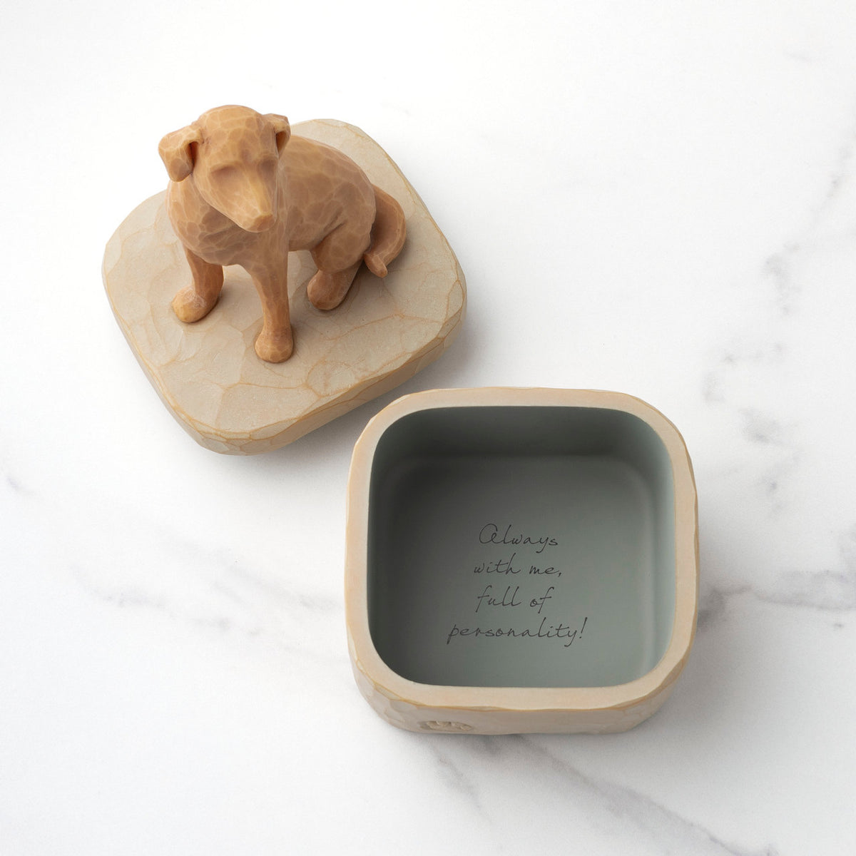 Inside: putty-colored square resin box with sentiment written on bottom inside of box. Detached lid