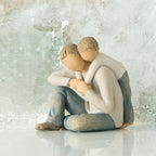 Willow Tree That's my Dad, 4”h hand-painted resin figure of seated man with younger boy leaning over his back, both in neutral clothes, in front of light grey painting