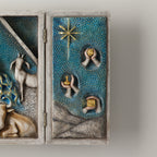 A hinged resin box, done in a Willow Tree format that tells the story of the Nativity