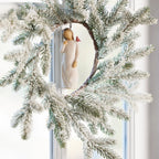 Willow Tree Messenger Ornament, 4”h hand-painted resin figure in cream dress with red cardinal on shoulder, brown elastic cord, hanging inside winter wreath